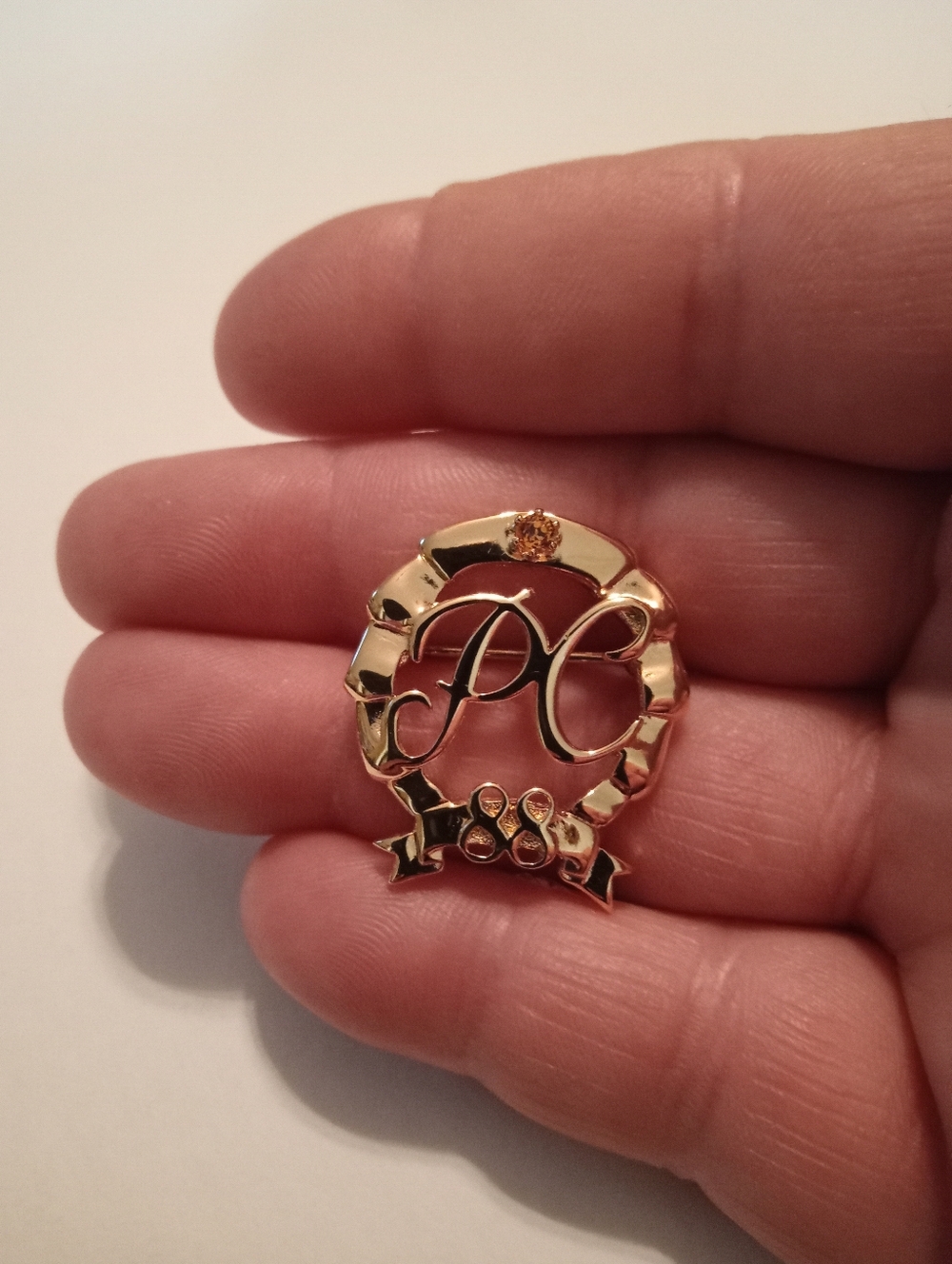 #1180.  Vintage 1988 Avon Presidents Club, Gold Toned And Rhinestone Brooch